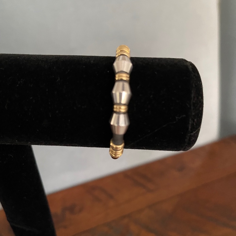 Silver and gold beads on a leather  bracelet